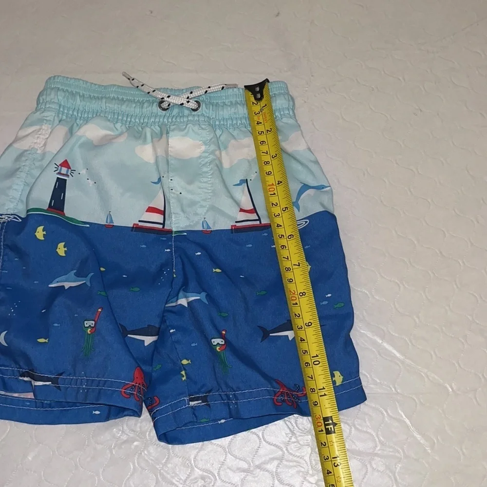 Carter’s sailboat print lined blue multicolor swim trunks